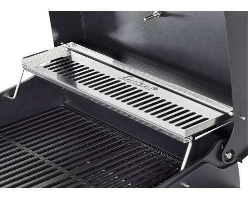 Grille de maintien au chaud en acier inoxydable sur un barbecue