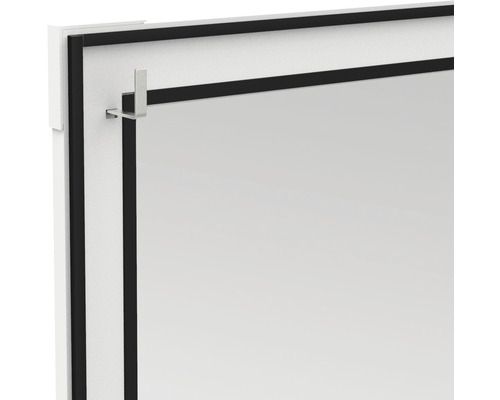 Vue détaillée d''un miroir avec un cadre noir et des crochets de fixation