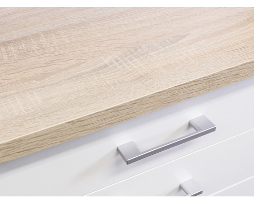 Detailaufnahme eines Möbels mit Holzplatte und Schubladen mit Griffen