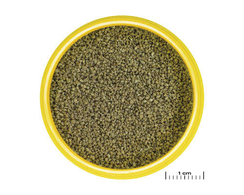 Fischfuttergranulat in gelbem Behälter