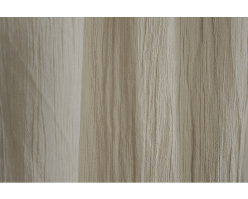 Gros plan d''un tissu de rideau beige texturé