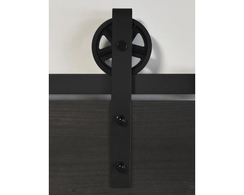 Vue détaillée d''une ferrure de porte coulissante avec suspension à roue