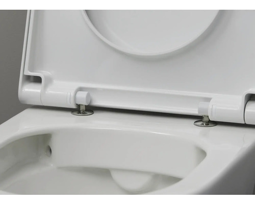 Gros plan d''un siège de toilette blanc avec couvercle ouvert