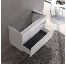 Weißer Waschtisch mit offener Schublade zur Wandmontage im Badezimmer.