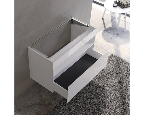 Weißer Waschtisch mit offener Schublade zur Wandmontage im Badezimmer.