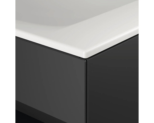 Vue détaillée d''un meuble de salle de bains avec lavabo blanc et façade foncée