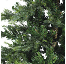 Gros plan sur un arbre de Noël artificiel avec des aiguilles vertes