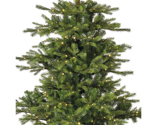 Vue détaillée d''un arbre de Noël artificiel avec éclairage.