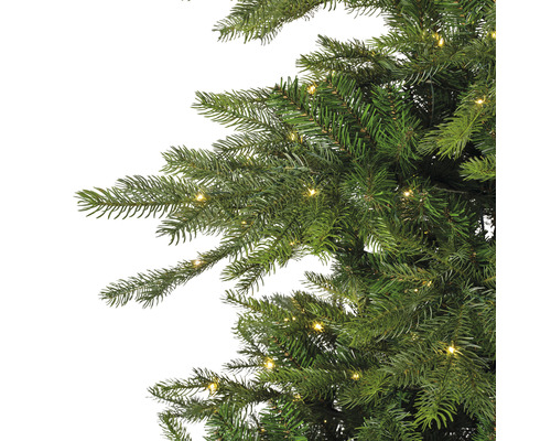 Gros plan d'un arbre de Noël artificiel avec éclairage.