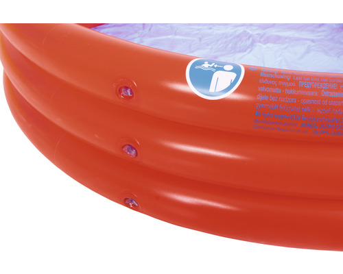 Detailansicht eines aufblasbaren Kinderpools mit Warnhinweis und Ventilen