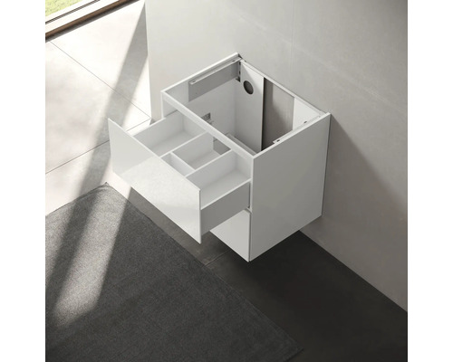 Meuble sous-vasque blanc avec tiroir pour montage mural dans la salle de bains.