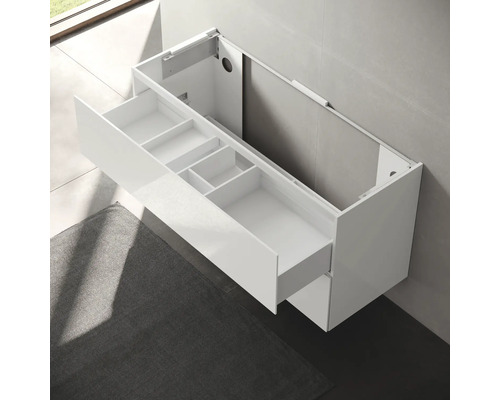 Meuble sous-lavabo blanc avec tiroir pour montage mural dans la salle de bain.