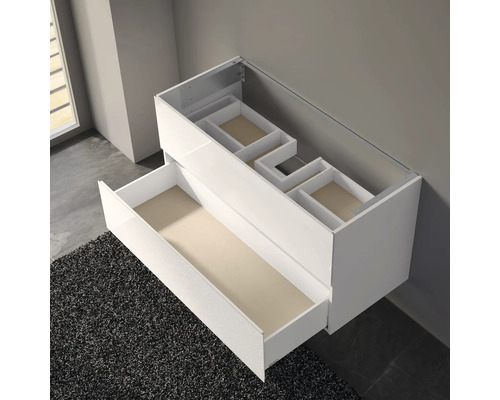 Meuble sous-lavabo blanc avec tiroirs pour le rangement de la salle de bain.