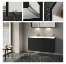 Salle de bains moderne avec meuble sous-lavabo noir, lavabo à poser blanc et miroir