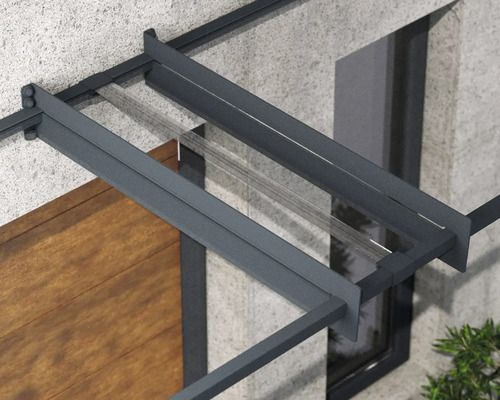 Vordach mit Stahlrahmen und Glaseinsatz über einer Haustür.