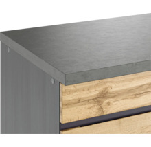 Vue détaillée d''un meuble de salle de bain avec plan de travail gris et tiroirs en bois