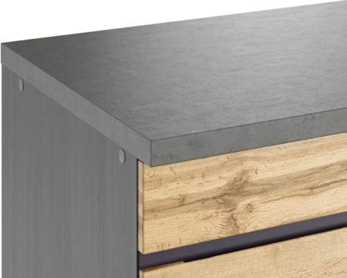 Gros plan d''un meuble sous-lavabo avec tiroirs en bois et plan de travail aspect béton