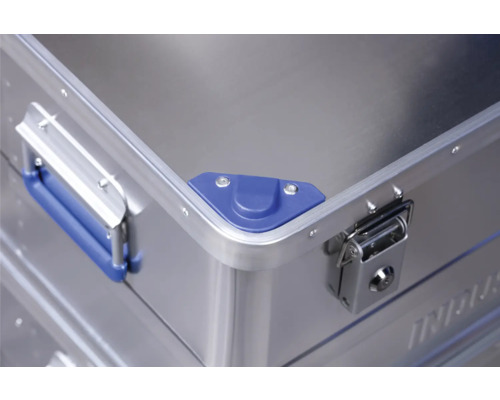 Vue détaillée d''une valise en aluminium avec poignée, protection d''angle et fermeture