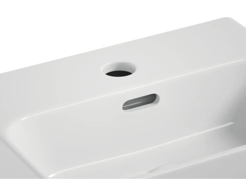 Vue détaillée d''un lavabo en céramique blanche avec trou de robinet et trop-plein