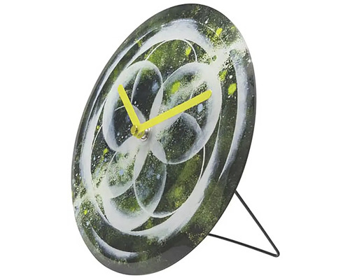 Horloge de table avec motif floral abstrait et aiguilles jaunes
