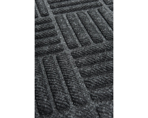 Vue détaillée d''un tapis de sol avec motif géométrique.