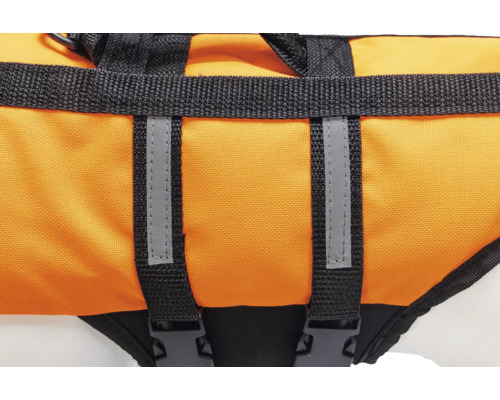 Détail d''un gilet de sauvetage pour chiens avec poignée et bandes réfléchissantes