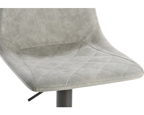 Gros plan d''un tabouret de bar avec revêtement matelassé