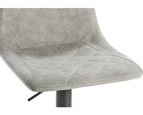 Gros plan d''un tabouret de bar avec assise en similicuir