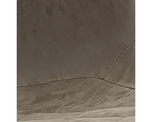 Gros plan d''un revêtement rembourré avec des surpiqûres décoratives