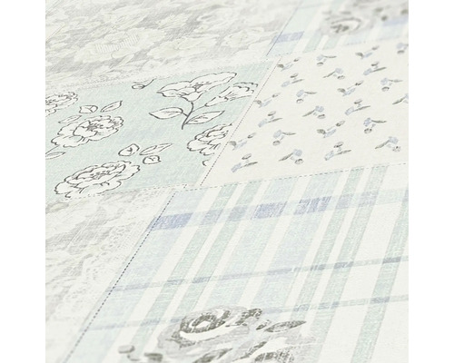 Gros plan d''un papier peint avec un motif patchwork de fleurs et de carreaux