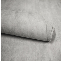 Papier peint gris aspect béton sur un rouleau