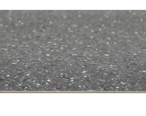 Nahaufnahme einer Bodenfliese mit gesprenkelter Oberfläche