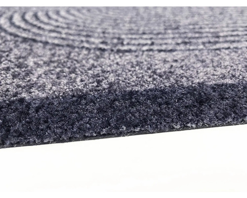 Detailansicht eines runden Teppichs mit konzentrischem Muster