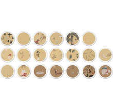 Motifs variés de papier cadeau sur le thème de Noël de forme ronde