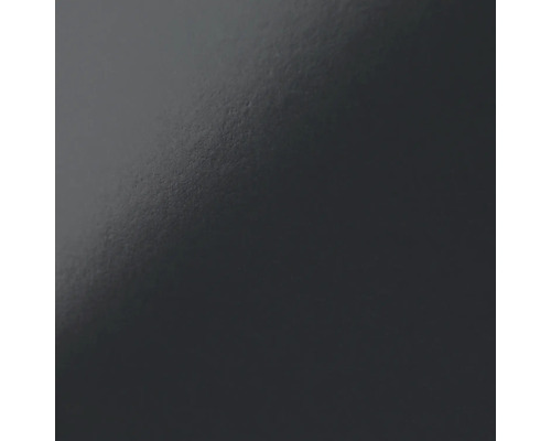 Nahaufnahme einer glatten, dunklen Oberfläche.