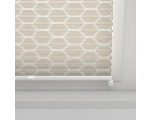 Store plissé avec motif géométrique sur la fenêtre