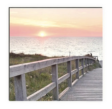 Dekobild mit einem Steg zum Meer bei Sonnenuntergang