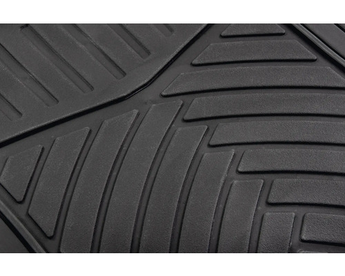 Detailaufnahme einer schwarzen Gummifußmatte mit Rillenmuster