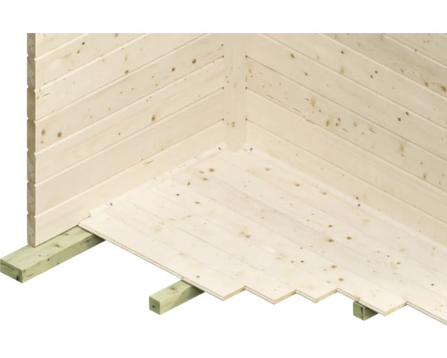 Vue détaillée d''une cabane en bois avec des planches à rainure et languette sur les murs et le sol