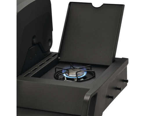 Gros plan d''un barbecue à gaz noir avec brûleur latéral et couvercle ouvert