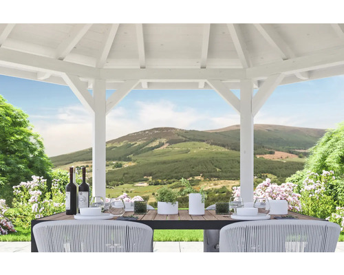 Pavillon clair avec table à manger, chaises et vue sur le paysage