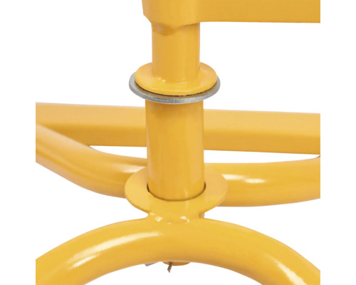 Detailaufnahme einer gelben Metallkonstruktion mit Unterlegscheibe.
