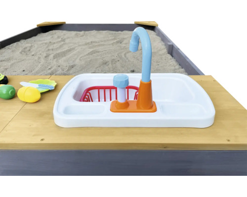 Vue détaillée d''un bac à sable avec évier de cuisine jouet et jouets