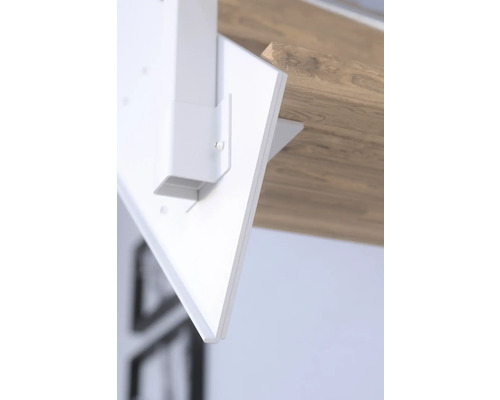 Vue détaillée d''un pied de table blanc fixé à un plateau de table.