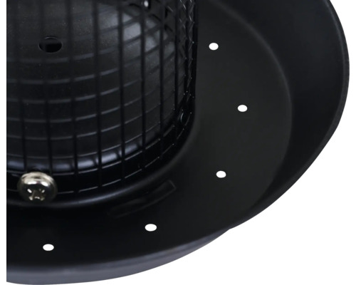 Vue détaillée d''un couvercle rond noir avec des trous et un insert de grille