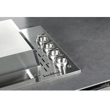 Logo Buschbeck et barbecue avec quatre boutons rotatifs
