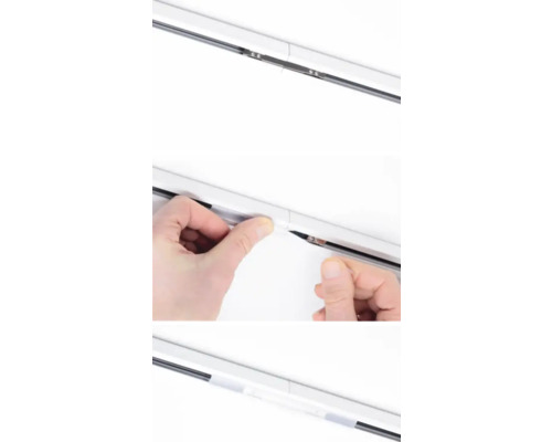 Detailansicht einer Gardinenschiene bei der Installation.