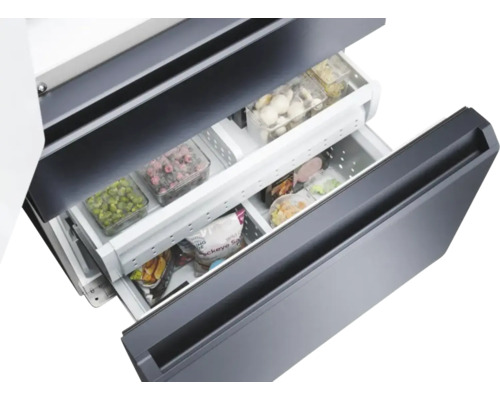 Tiroirs de congélateur ouverts avec des aliments