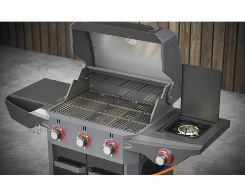 Grill à gaz avec capot ouvert, brûleur latéral et espace de rangement