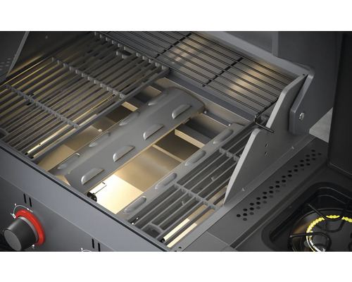 Vue intérieure d''un gril à gaz avec grille et couvercle de brûleur